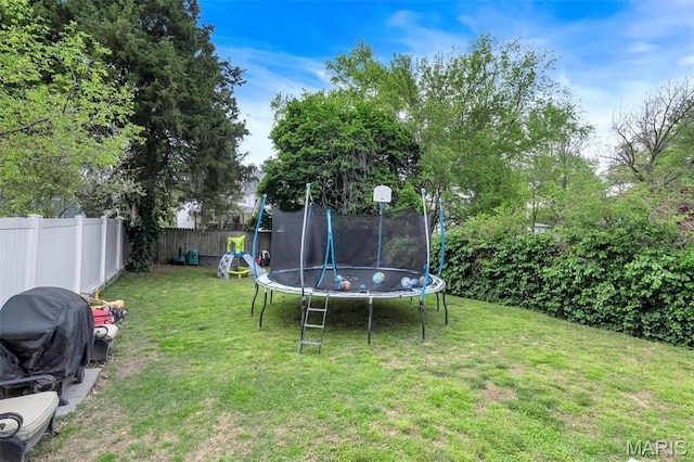 view of yard with a trampoline