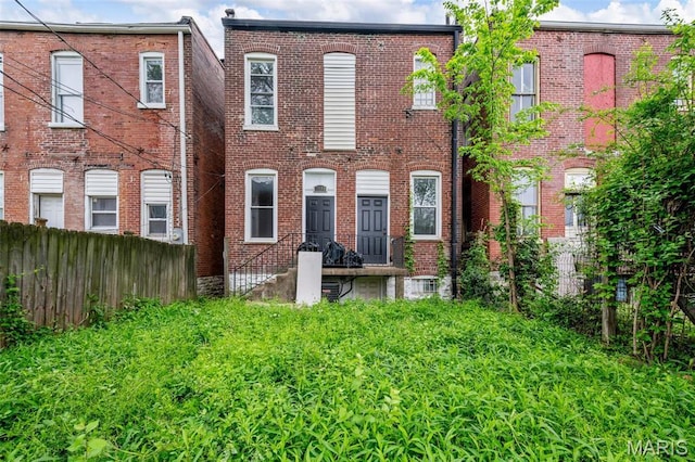 2148 Oregon Ave, Saint Louis, MO 63104 - view of front facade featuring fence and brick siding
