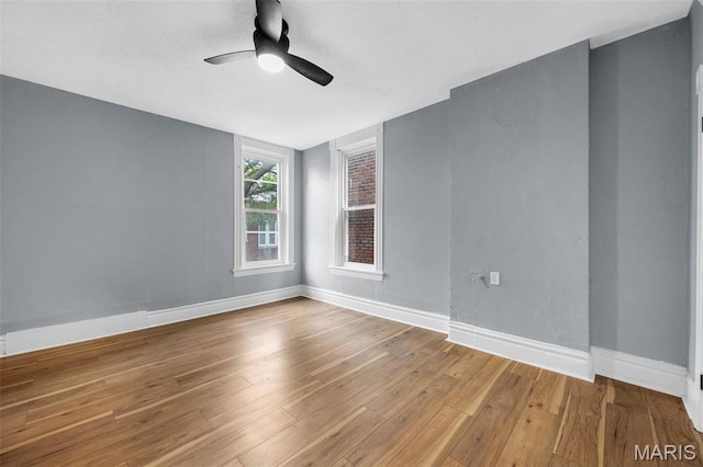 2148 Oregon Ave, Saint Louis, MO 63104 - spare room featuring a ceiling fan, wood finished floors, and baseboards