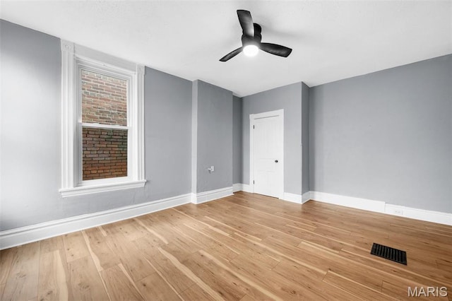2148 Oregon Ave, Saint Louis, MO 63104 - unfurnished room with baseboards, a ceiling fan, and light wood-type flooring