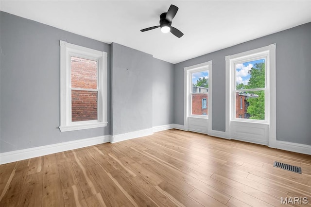 2148 Oregon Ave, Saint Louis, MO 63104 - empty room with baseboards, wood finished floors, and a ceiling fan