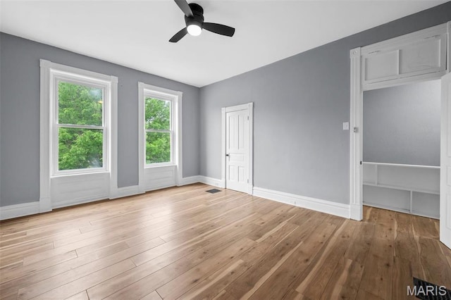2148 Oregon Ave, Saint Louis, MO 63104 - unfurnished bedroom with baseboards, wood finished floors, and ceiling fan