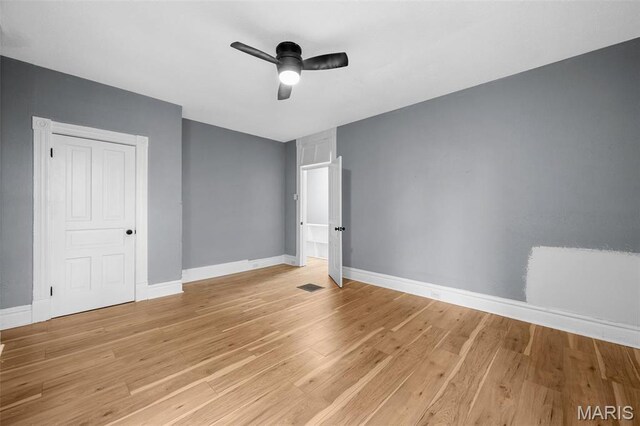 2148 Oregon Ave, Saint Louis, MO 63104 - empty room featuring ceiling fan, light wood finished floors, and baseboards