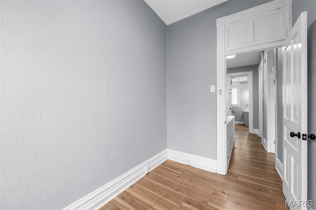 2148 Oregon Ave, Saint Louis, MO 63104 - corridor featuring baseboards and light wood finished floors