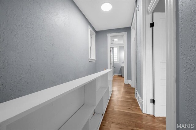 2148 Oregon Ave, Saint Louis, MO 63104 - hall with a textured wall, wood finished floors, and baseboards