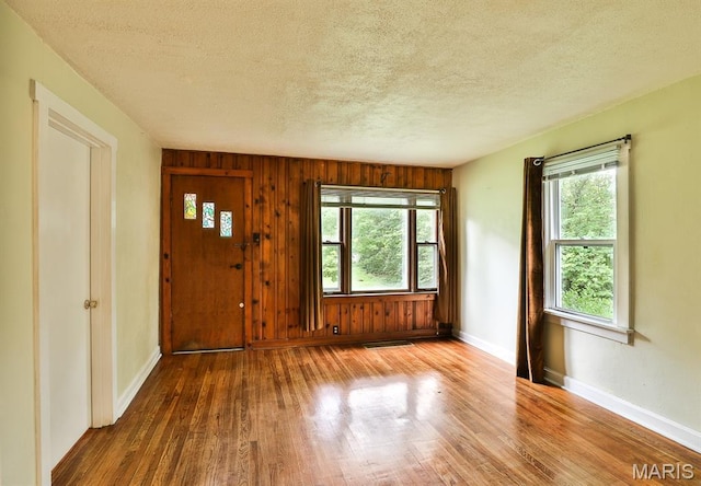 1046 Marshall Ave, Saint Louis, MO 63119 - entryway featuring wood finished floors, a textured ceiling, and baseboards