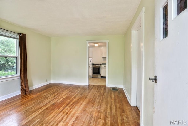 1046 Marshall Ave, Saint Louis, MO 63119 - spare room featuring light wood-style floors and baseboards