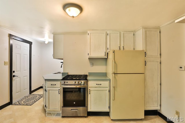 1046 Marshall Ave, Saint Louis, MO 63119 - kitchen featuring freestanding refrigerator, stainless steel range with gas cooktop, baseboards, crown molding, and light floors