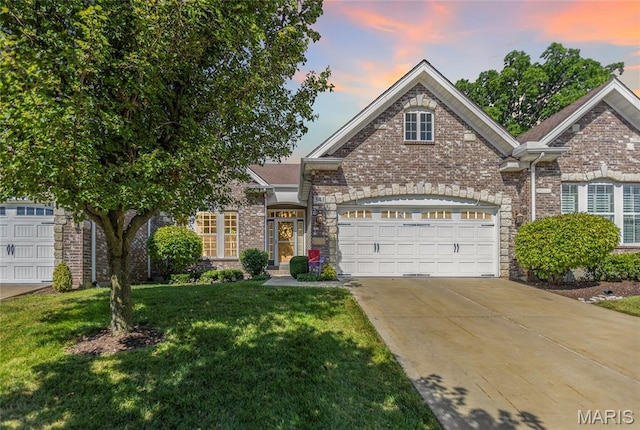 341 Brunhaven Ct, Chesterfield, MO 63017 - traditional home with concrete driveway, a yard, a garage, and brick siding
