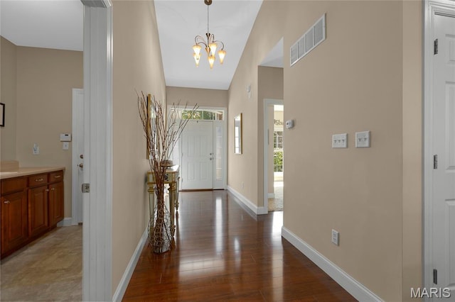 341 Brunhaven Ct, Chesterfield, MO 63017 - foyer featuring a chandelier, wood finished floors, and a towering ceiling