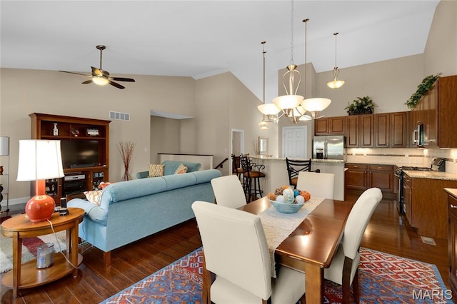 341 Brunhaven Ct, Chesterfield, MO 63017 - dining area featuring high vaulted ceiling, dark wood-type flooring, a ceiling fan, and a chandelier