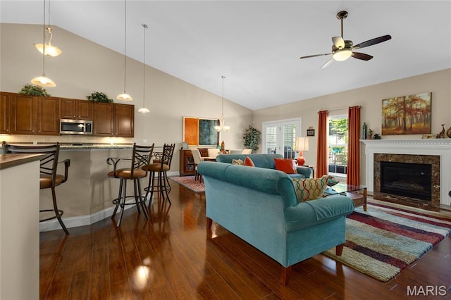 341 Brunhaven Ct, Chesterfield, MO 63017 - living room with high vaulted ceiling, dark wood-style floors, ceiling fan, and a premium fireplace