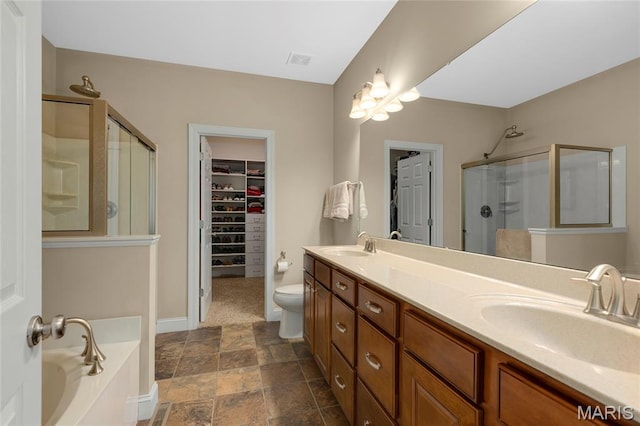 341 Brunhaven Ct, Chesterfield, MO 63017 - bathroom with a shower stall, double vanity, a garden tub, a spacious closet, and stone finish floors