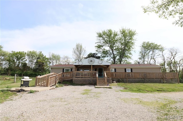 view of front of house featuring a wooden deck