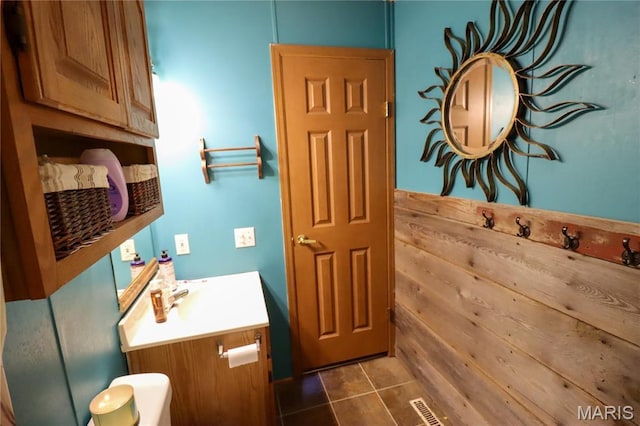 bathroom with tile patterned flooring and vanity