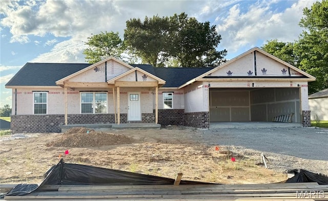 11 Bluebell Way, Jackson, MO 63755 - property in mid-construction with brick siding, an attached garage, and gravel driveway