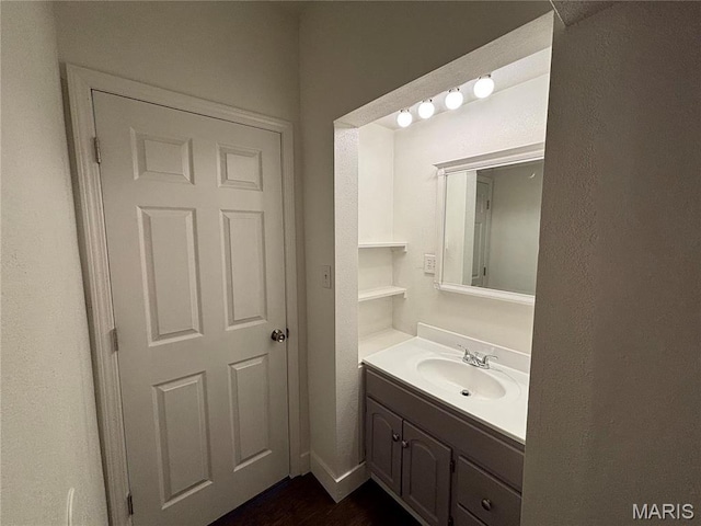 1014 E Broadway, Centralia, IL 62801 - bathroom with vanity and wood finished floors