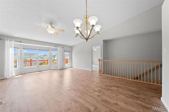 1149 Silo Bnd Unit 341A, Wentzville, MO 63385 - empty room featuring a chandelier, a textured ceiling, wood finished floors, lofted ceiling, and ceiling fan