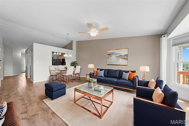 1149 Silo Bnd Unit 341A, Wentzville, MO 63385 - living room featuring ceiling fan, light wood-type flooring, a chandelier, and lofted ceiling