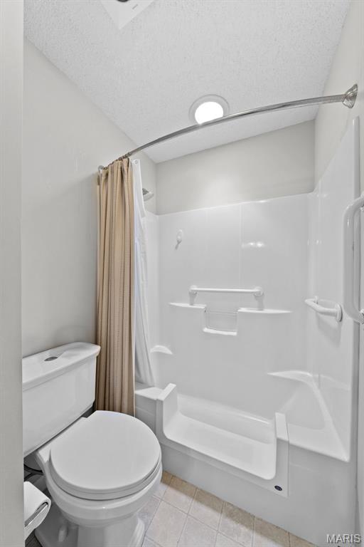 1149 Silo Bnd Unit 341A, Wentzville, MO 63385 - full bath featuring shower / tub combo and tile patterned flooring