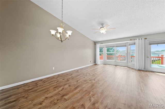 1149 Silo Bnd Unit 341A, Wentzville, MO 63385 - empty room featuring ceiling fan, plenty of natural light, wood finished floors, a textured ceiling, and a chandelier