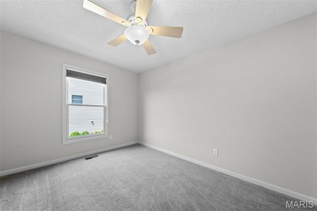 1149 Silo Bnd Unit 341A, Wentzville, MO 63385 - carpeted empty room featuring a textured ceiling and a ceiling fan