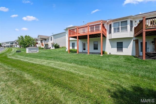 1149 Silo Bnd Unit 341A, Wentzville, MO 63385 - back of house with a lawn, a wooden deck, and a residential view
