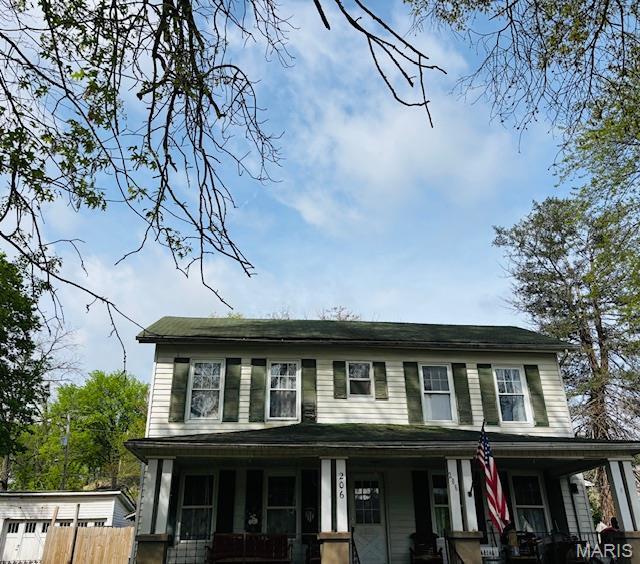 206 1st St, Steelville, MO 65565 - view of front facade with a porch