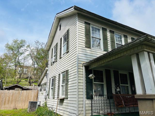 206 1st St, Steelville, MO 65565 - view of property exterior with covered porch and cooling unit