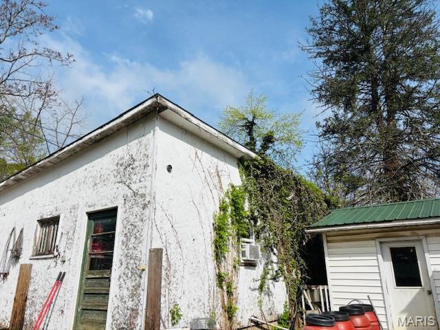 206 1st St, Steelville, MO 65565 - view of side of property featuring metal roof