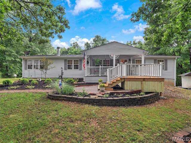 3870 Wilkinson Rd, De Soto, MO 63020 - view of front of home featuring a front lawn, a sunroom, and a deck