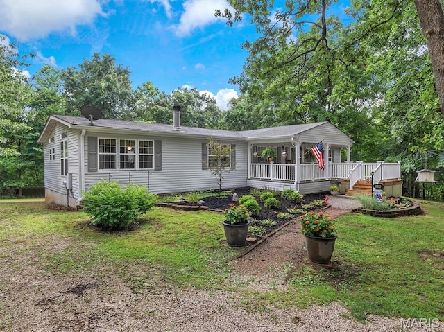 3870 Wilkinson Rd, De Soto, MO 63020 - single story home featuring a front yard and a deck