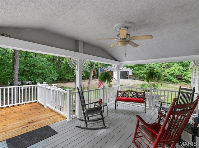 3870 Wilkinson Rd, De Soto, MO 63020 - wooden terrace featuring a ceiling fan and an outbuilding