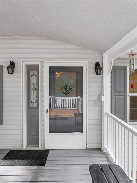 3870 Wilkinson Rd, De Soto, MO 63020 - property entrance featuring a porch