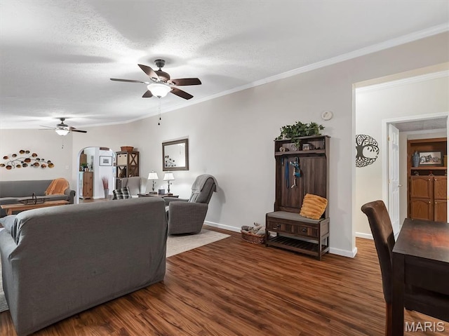 3870 Wilkinson Rd, De Soto, MO 63020 - living area with a ceiling fan, arched walkways, dark wood-style floors, ornamental molding, and a textured ceiling