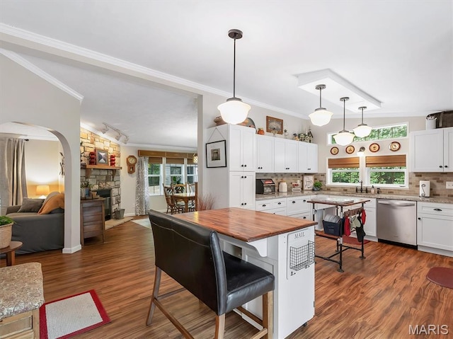 3870 Wilkinson Rd, De Soto, MO 63020 - kitchen featuring stainless steel dishwasher, butcher block countertops, crown molding, tasteful backsplash, and healthy amount of natural light