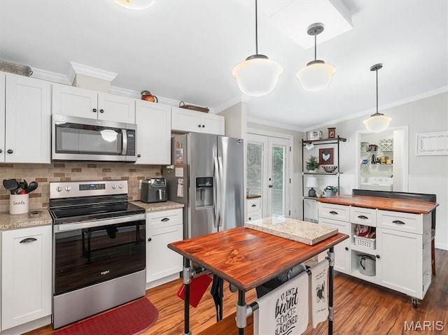 3870 Wilkinson Rd, De Soto, MO 63020 - kitchen featuring appliances with stainless steel finishes, wooden counters, ornamental molding, wood finished floors, and white cabinets