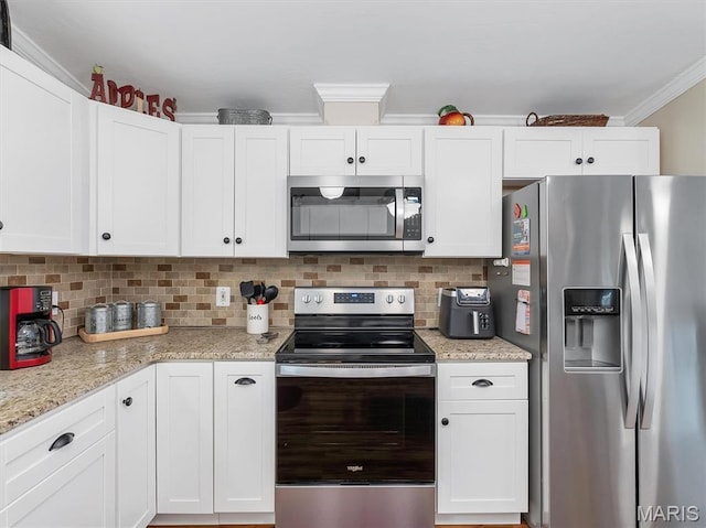 3870 Wilkinson Rd, De Soto, MO 63020 - kitchen with appliances with stainless steel finishes, white cabinets, crown molding, decorative backsplash, and light stone countertops
