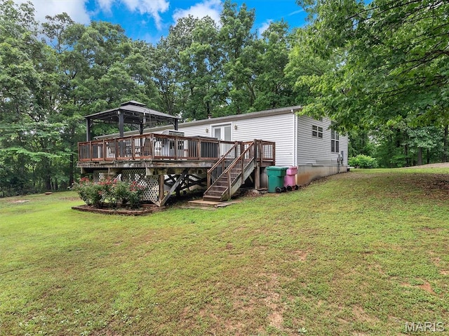 3870 Wilkinson Rd, De Soto, MO 63020 - back of property with a yard, a deck, a gazebo, stairway, and view of scattered trees