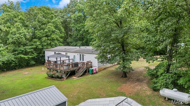 3870 Wilkinson Rd, De Soto, MO 63020 - back of property featuring a gazebo, a deck, and a lawn