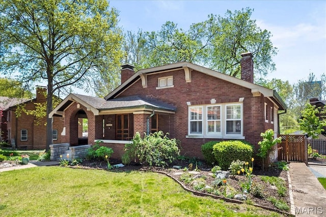 7440 Kingsbury Blvd, Saint Louis, MO 63130 - view of front of house featuring a chimney and brick siding