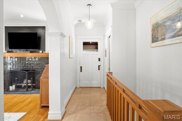 7440 Kingsbury Blvd, Saint Louis, MO 63130 - corridor featuring crown molding, baseboards, and light tile patterned floors