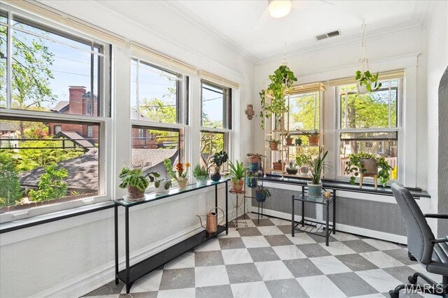 7440 Kingsbury Blvd, Saint Louis, MO 63130 - sunroom / solarium featuring crown molding, radiator heating unit, and tile patterned floors