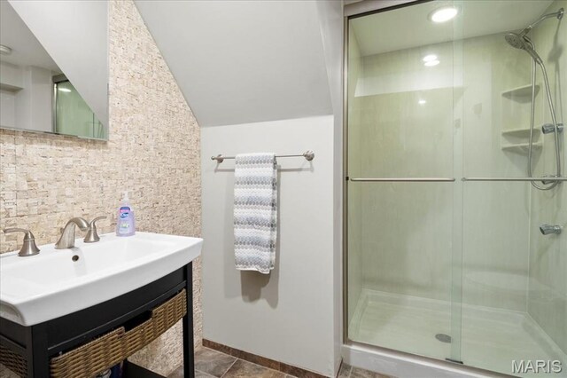 7440 Kingsbury Blvd, Saint Louis, MO 63130 - bathroom with a shower stall, tasteful backsplash, vanity, and lofted ceiling