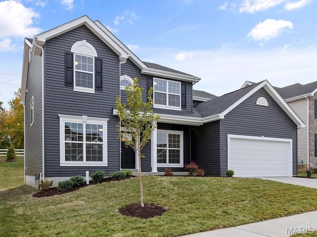 traditional home featuring driveway, a front lawn, and a garage