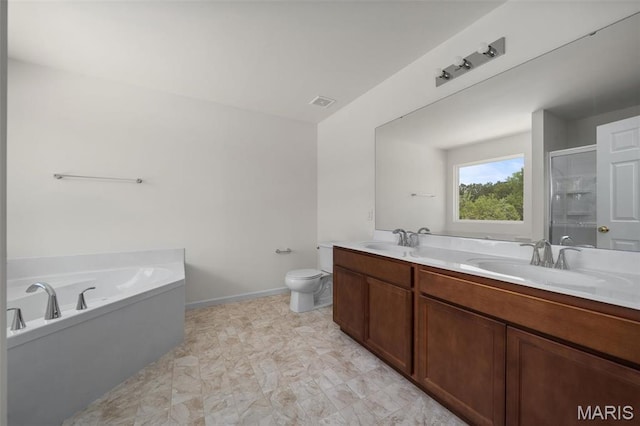 full bathroom with a shower stall, toilet, double vanity, and a garden tub