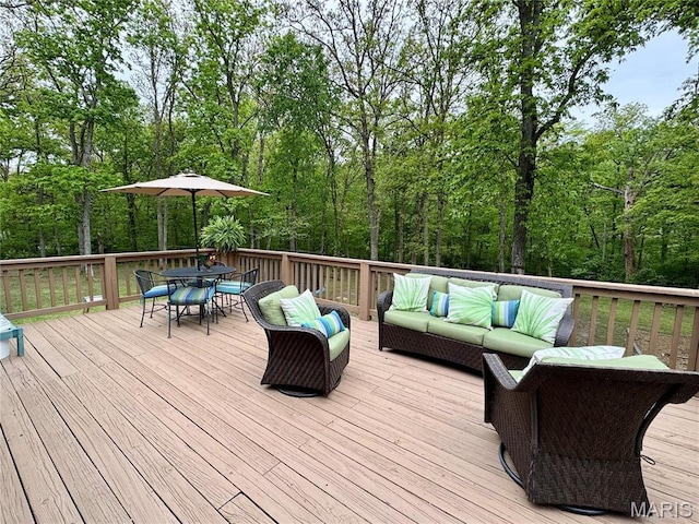 wooden deck with an outdoor living space and outdoor dining space