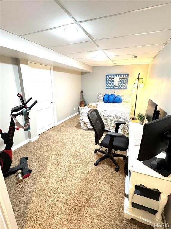 bedroom with carpet and baseboards