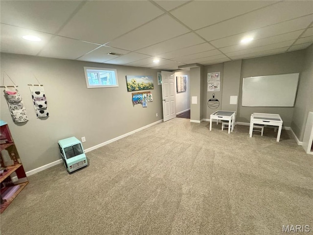 basement featuring heating unit, carpet floors, a drop ceiling, baseboards, and recessed lighting