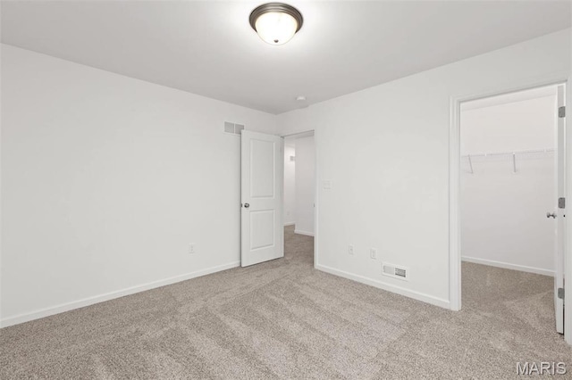 1170 Bloomfield Dr, Eureka, MO 63025 - unfurnished bedroom featuring carpet floors, baseboards, a walk in closet, and a closet
